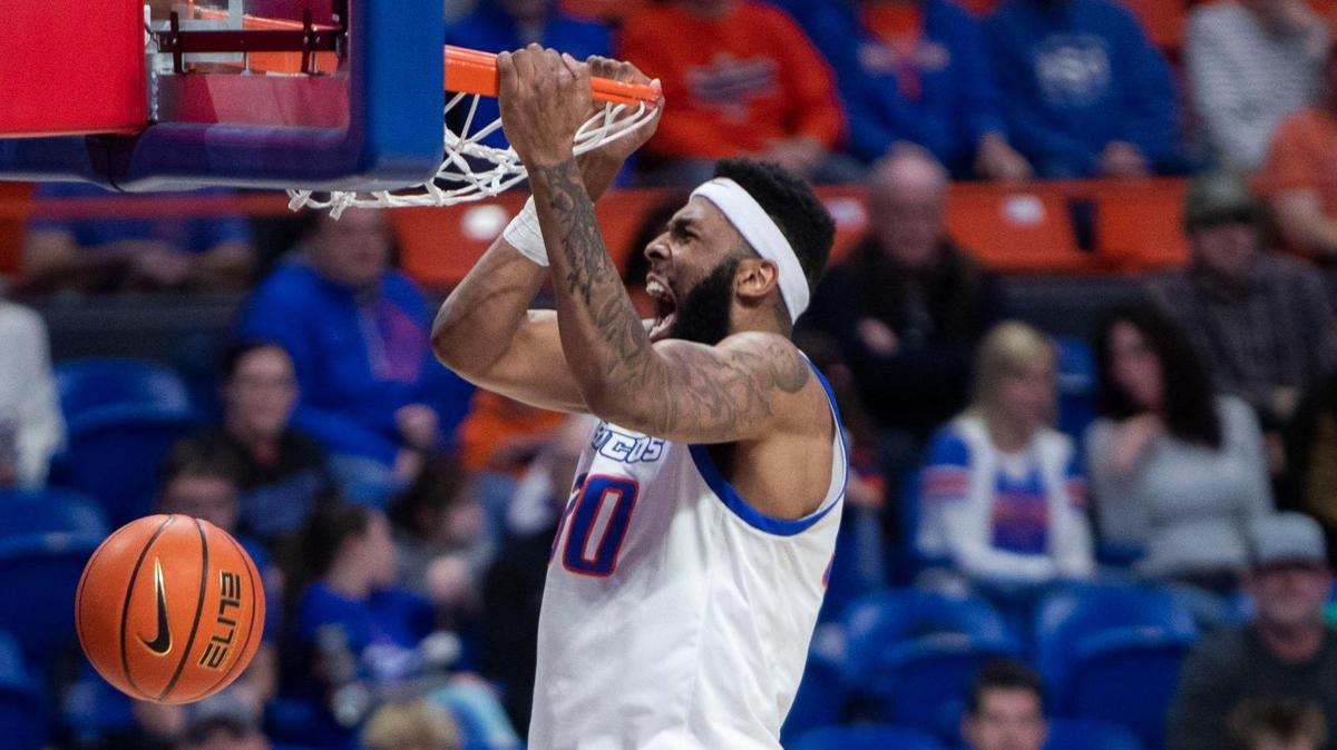 Boise State’s Naje Smith throws down a dunk against Mountain West foe Utah State during the Broncos’ 82-59 win last weekend at ExtraMile Arena.