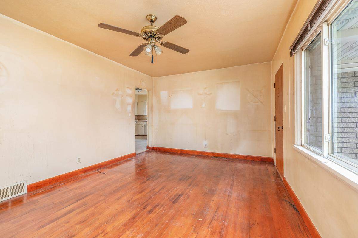 Parts of the walls and hardwood floors are damaged in the Woody Drive home.