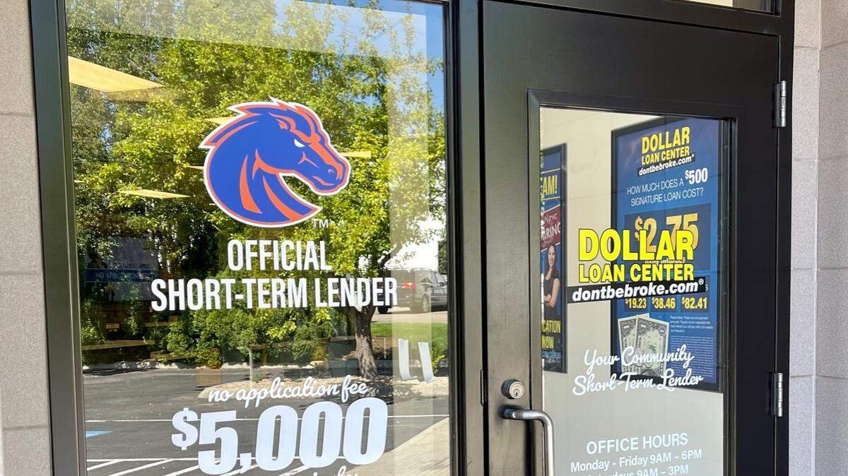 The front door of the new Dollar Loan Center store in Boise prominently displays the Boise State Broncos logo as part of a sponsorship the payday lender has with the school.