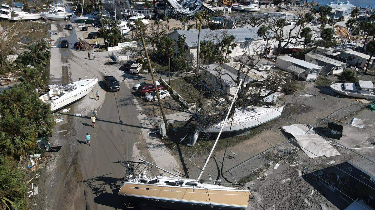 Boats lie scattered amidst mobile homes after the passage of Hurricane Ian, in the San Carlos area of Fort Myers Beach, Fla., Thursday, Sept. 29, 2022.