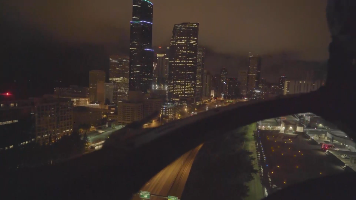 A pilot prepares to land an air ambulance at a University of Washington medical center in Seattle. This image is from inside the helicopter.