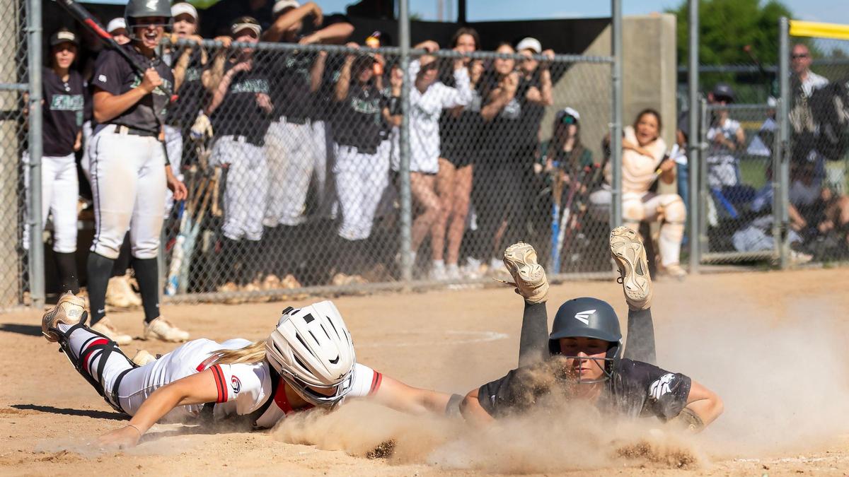 Eagle’s Erin Thoreson slides home safely before the tag from Owyhee catcher McKenna Schab in the fifth inning Tuesday at Borah High. Eagle upset Owyhee 8-2 to clinch a state tournament berth and advance to the district championship Thursday.
