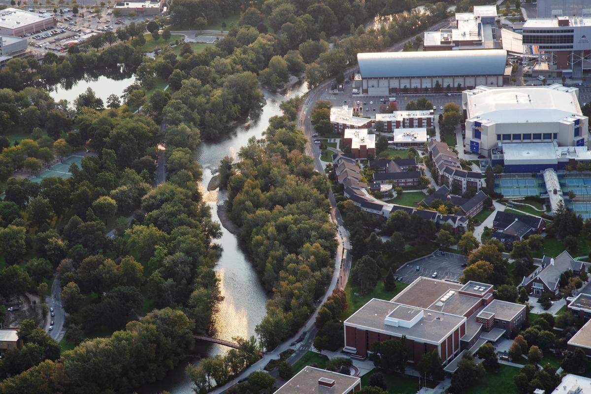 The Boise River winds past the Boise State University campus, seen from above, on Sept. 2, 2021.