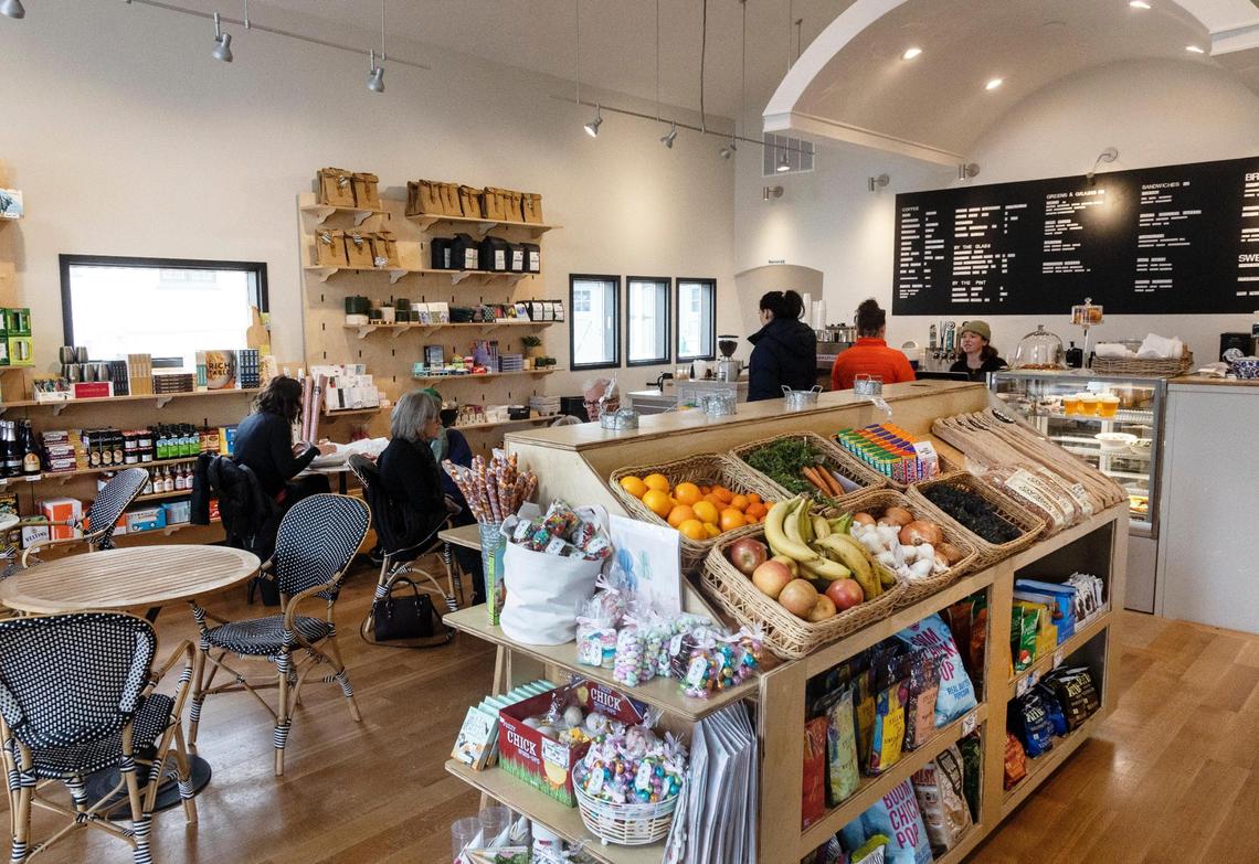 A Roosevelt Market display features candy, produce, breads and snacks. The market, with tables and chairs for customers to eat and drink, recently reopened under new management.