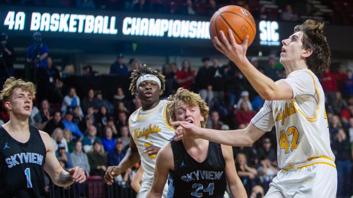Bishop Kelly junior Mason Suboh-Meuret scores late in the fourth quarter against Skyview in the 4A District Three boys basketball tournament championship game at Idaho Central Arena on Thursday. Bishop Kelly won 52-49.