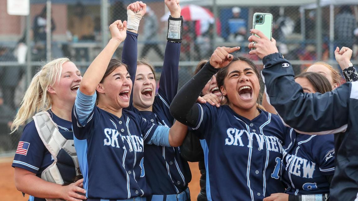 Skyview celebrates winning the 5A state softball championship on their home field Saturday after beating Rocky Mountain 14-8.