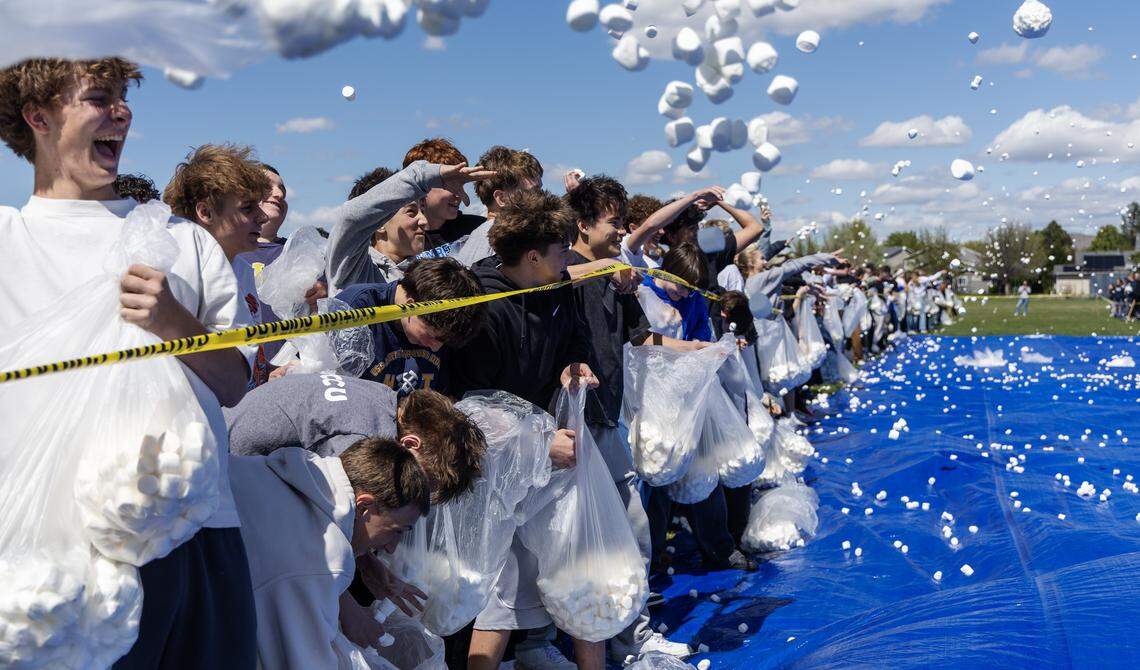 Students at Les Bois Junior High School attempt to break the world record for the largest marshmallow battle, Friday, April 17, 2026. The student body threw 2270 pounds, or approximately 145,000 marshmallows at each other on a makeshift battlefield behind the school. 