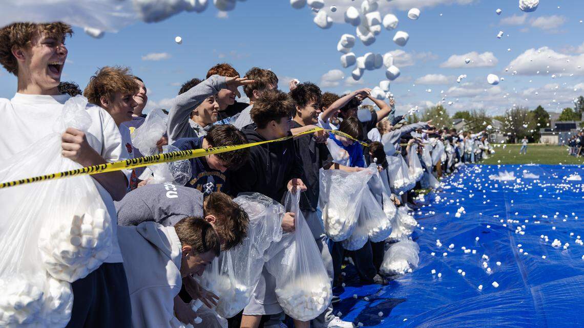 Students at Les Bois Junior High School attempt to break the world record for the largest marshmallow battle, Friday, April 17, 2026. The student body threw 2270 pounds, or approximately 145,000 marshmallows at each other on a makeshift battlefield behind the school. 
