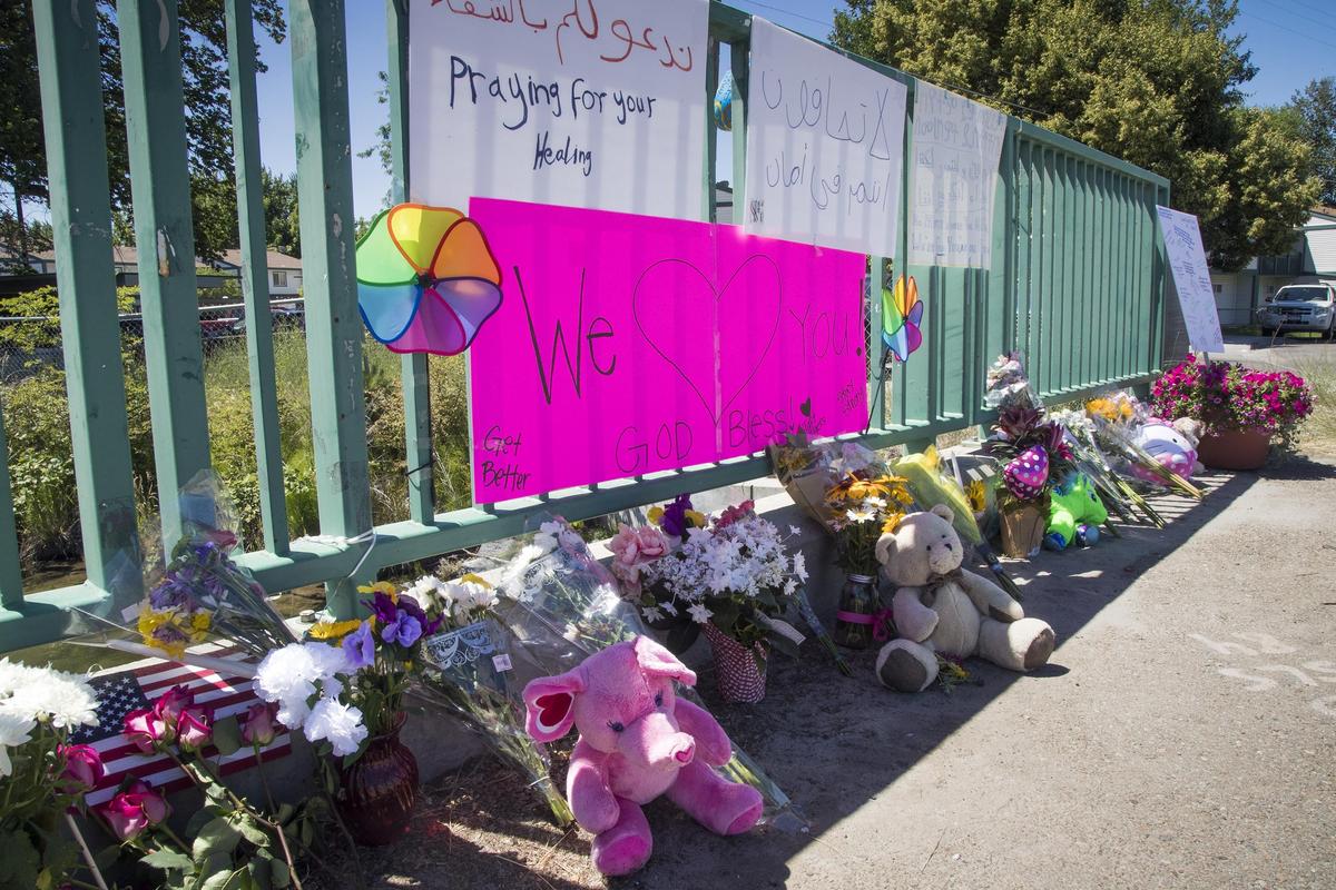Piles of flowers and stuffed animals kept growing Tuesday at outside the Wylie Street Station Apartments in Boise, site of the mass stabbing Saturday that killed a girl who was having her third birthday party and injured five other children and three adults.