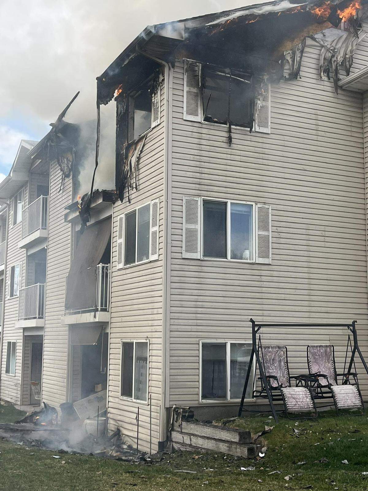 The fire started in the third-floor apartment and spread to the attic, which affected adjoining units, according to the fire department.