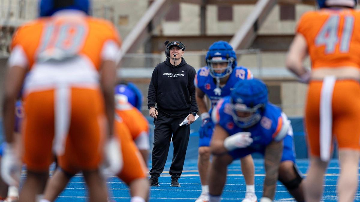 Boise State coach Spencer Danielson stands behind a play during the spring game at Albertsons Stadium in April.