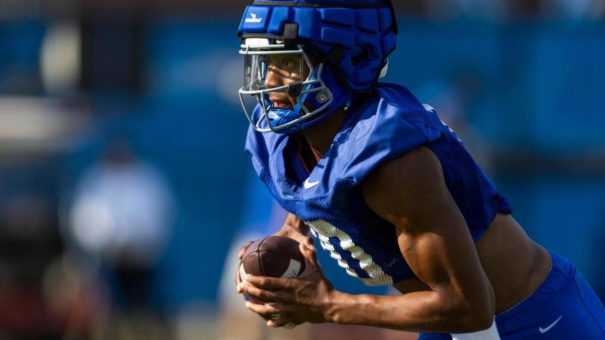 Boise State quarterback Taylen Green runs an option drill as the Broncos prepare for the 2023 football season at fall camp.