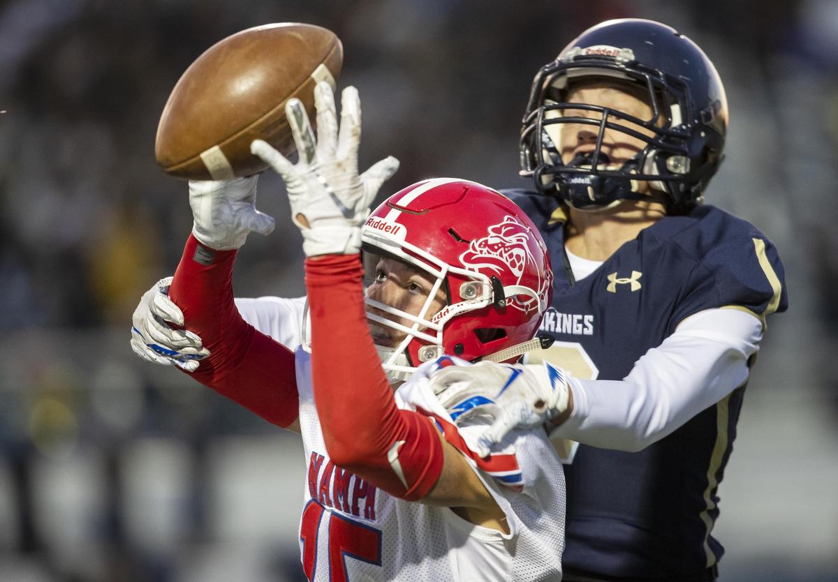 Middleton defensive back Merit Foote breaks up a pass intended for Nampa’s Jace Mann on Oct. 11 at Middleton High School.