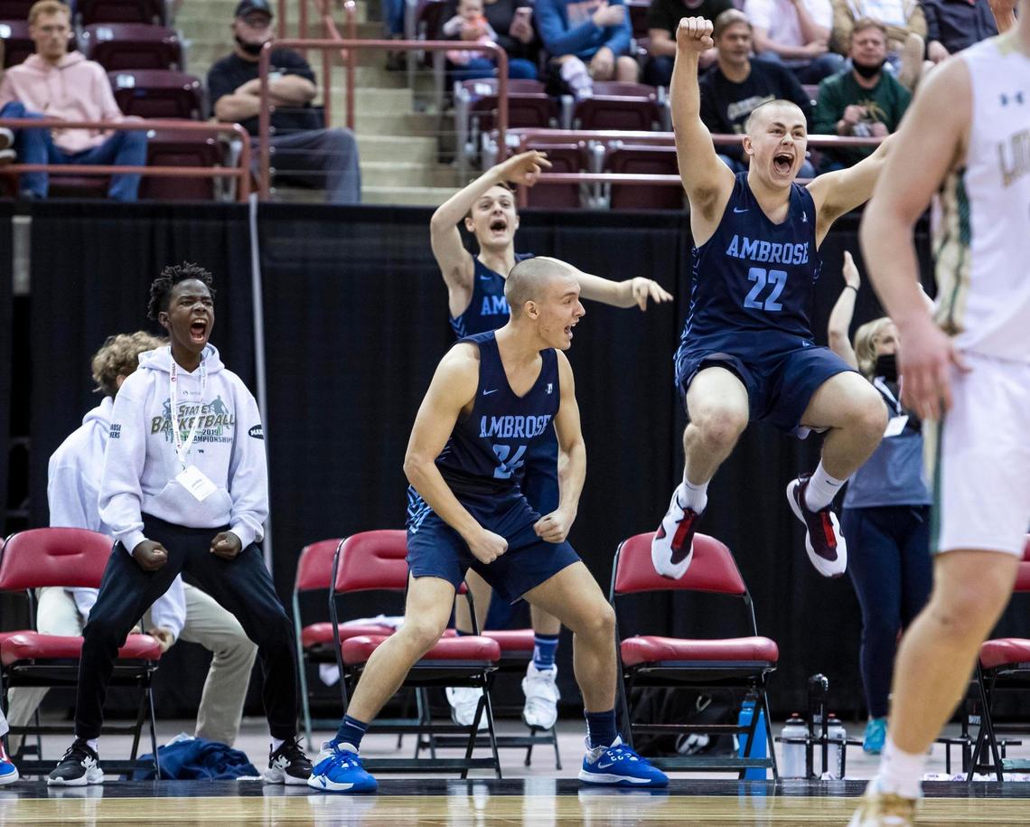 Ambrose’s bench explodes after a 3-pointer to retake the lead from St. Maries in the fourth quarter Saturday at the Ford Idaho Center in Nampa.