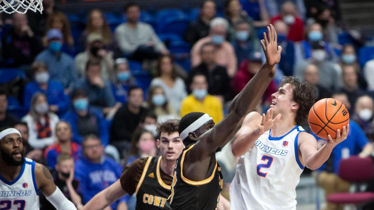 Boise State forward Tyson Degenhart scores in the paint defended by Wyoming forward Graham Ike in the second half last season at ExtraMile Arena in Boise.