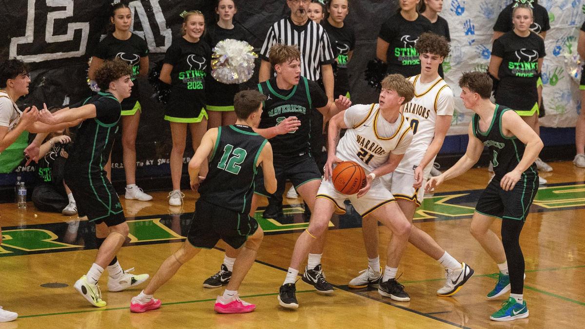 Meridian senior Jacob Hudgins grabs on his four rebounds Tuesday.