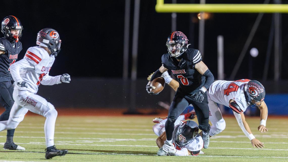 Boise senior wide receiver Cooper Smith breaks one tackle and looks for more running room Friday against Owyhee.