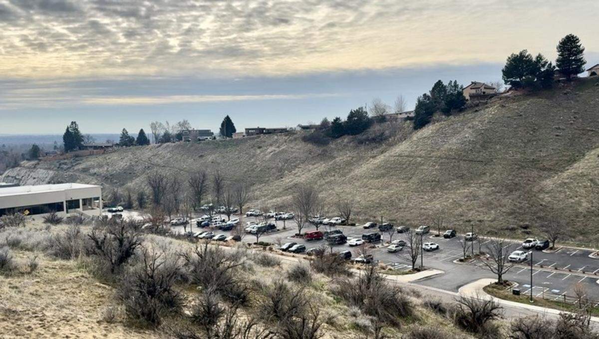Healthwise, which until 2024 operated its health-information service from the white office building at left, owns the parking lot that could become Blue Sky Commons in Boise’s North End.