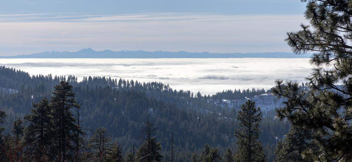 A view from Bogus Basin Road shows the inversion that has smothered the Boise area, with the Owyhee Mountains just visible to the south.