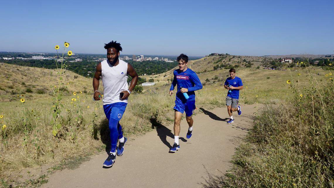 Boise State senior quarterback Jaylon Henderson leads a group of Broncos up Table Rock. He’s followed by freshman kicker/punter Gavin Wale, middle, and freshman wide receiver Trevor Cole.