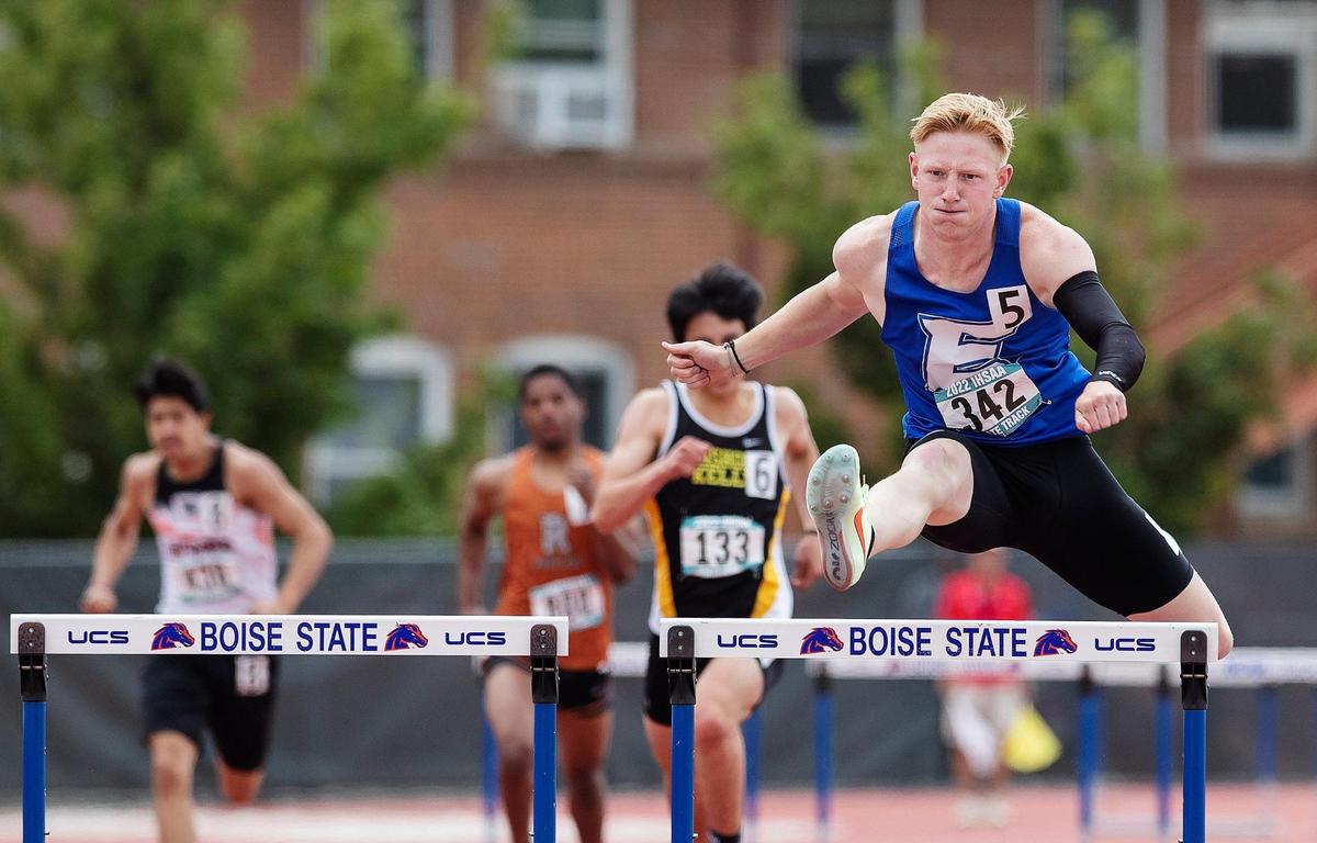 Landon Helms of Emmett comes in first in the 4A boys 300-meter hurdles Saturday at Dona Larsen Park. Helms finished the state meet with four gold medals.