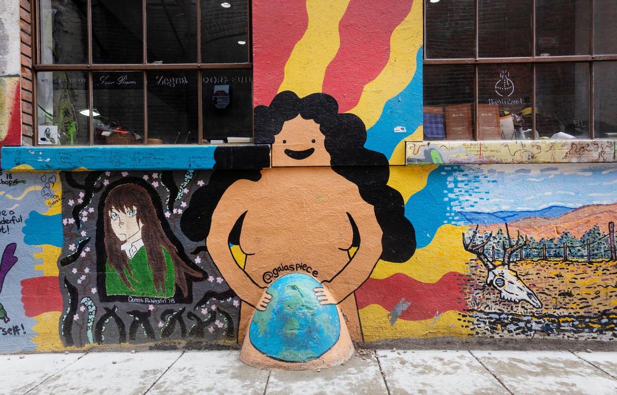 Graffiti-style art lines the walls of Freak Alley Gallery.