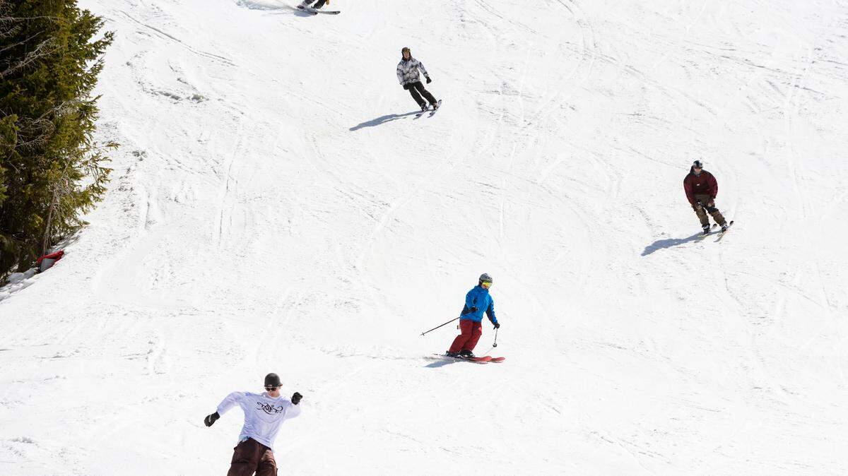 People ski and snowboard on the last day of the season at Bogus Basin in April. The resort opens on Thanksgiving.