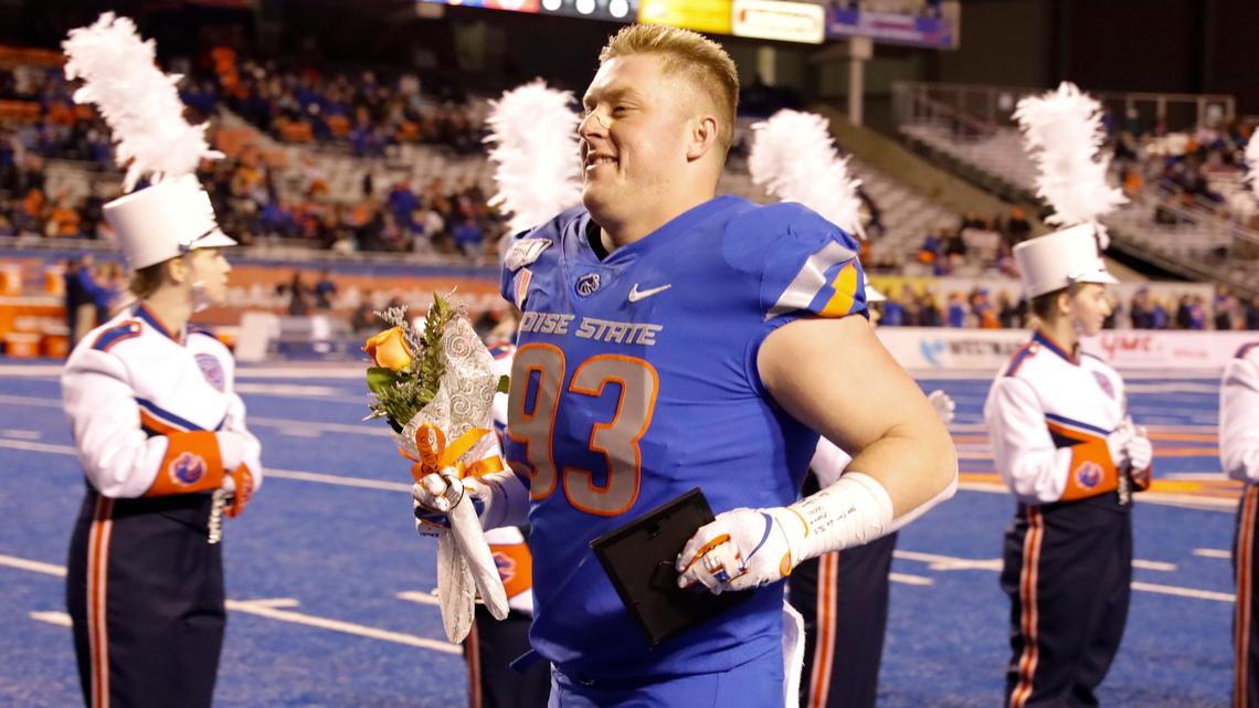 Boise State defensive end Chase Hatada runs onto the field during senior night before the Broncos’ 42-9 win over New Mexico on Nov. 16 at Albertsons Stadium.