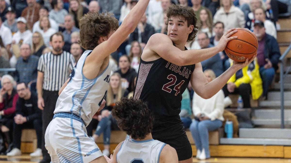 Nampa Christian senior Addison Taylor looks for a hole in the Ambrose defense in the 2A District Three Tournament championship game Feb. 21 at Vallivue.