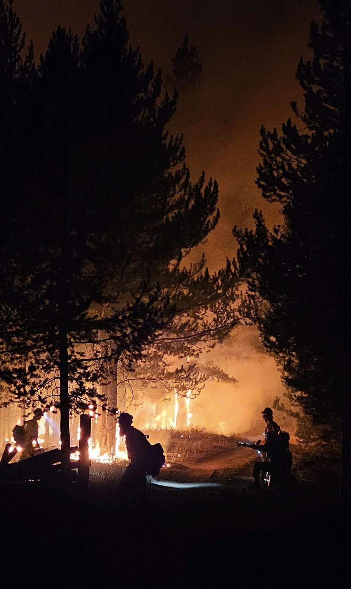 Firefighters work through the night to combat the Wapiti fire.