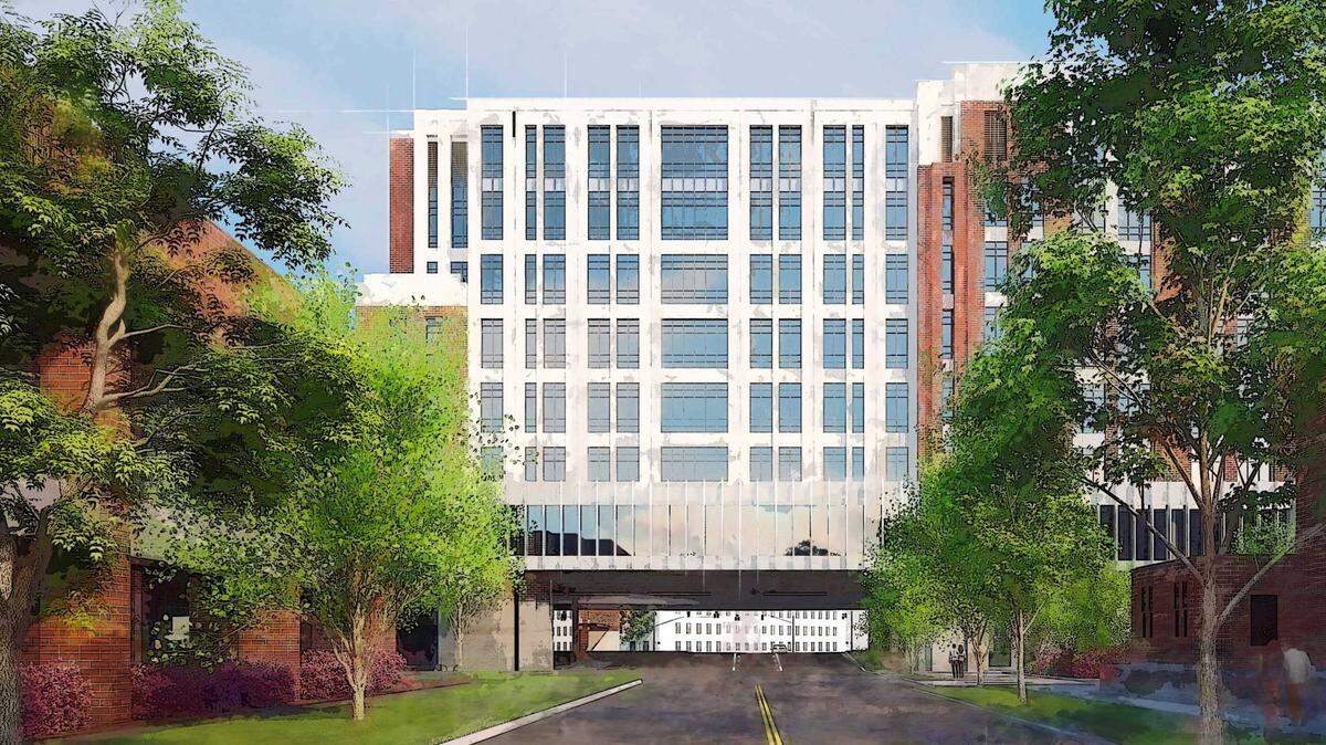 An architect’s view of the 1st Street medical office plaza. This view shows the office building as it spans 1st Street, as seen from the street right-of-way looking north.