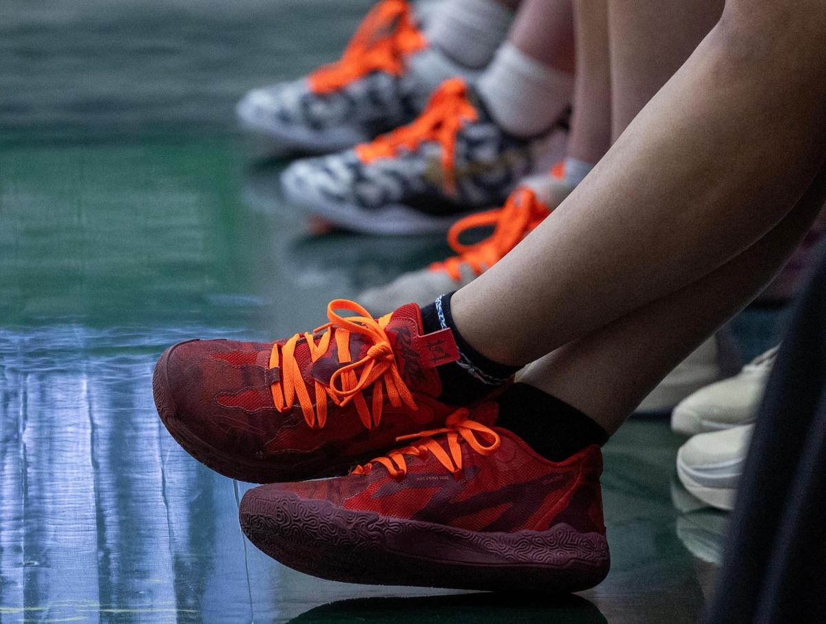 Teammates and friends of Eagle junior Audrey Baxter wore orange, a color associated with the fight against leukemia, during a fundraiser Thursday during the girls basketball games at Eagle High School.
