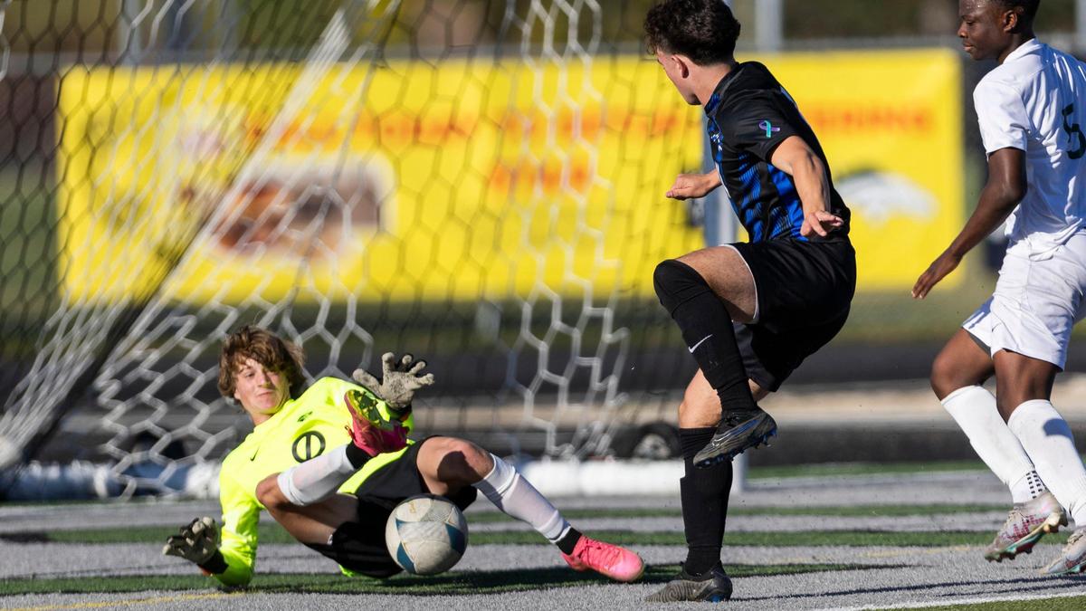 Borah goalkeeper Christian Griffith blocks a shot from Timberline’s Kai Anitok during the first round of the state tournament last season.