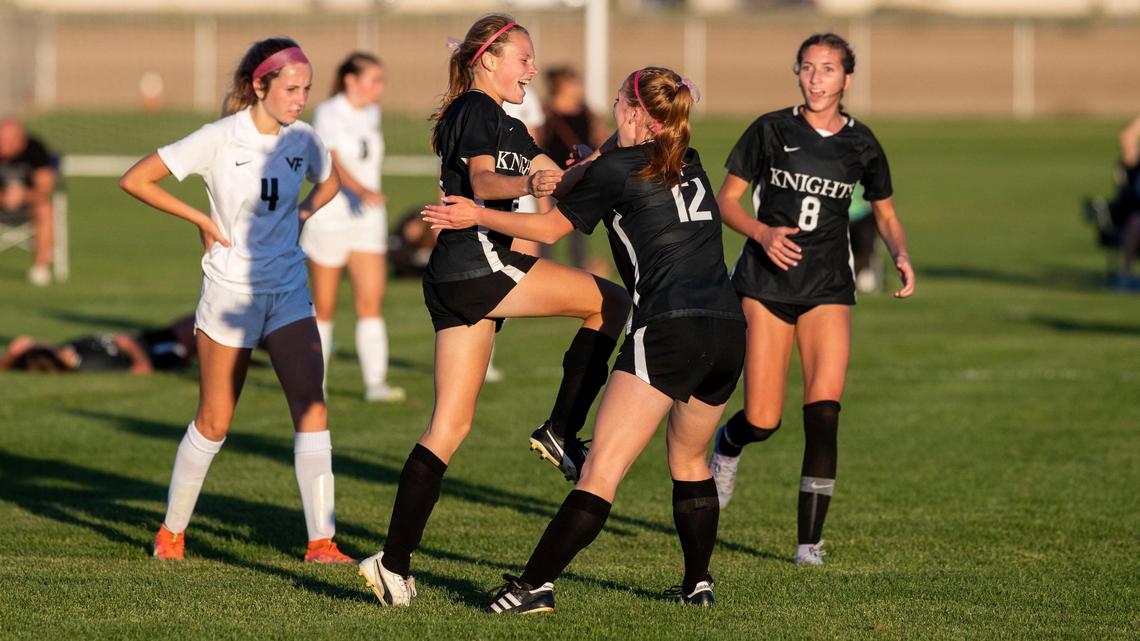 Bishop Kelly freshman Erin DiVittorio celebrates with teammates after scoring the game-winning goal in the Knights’ 3-1 victory over Vallivue in the 4A District Three girls soccer championship Thursday at Vallivue.