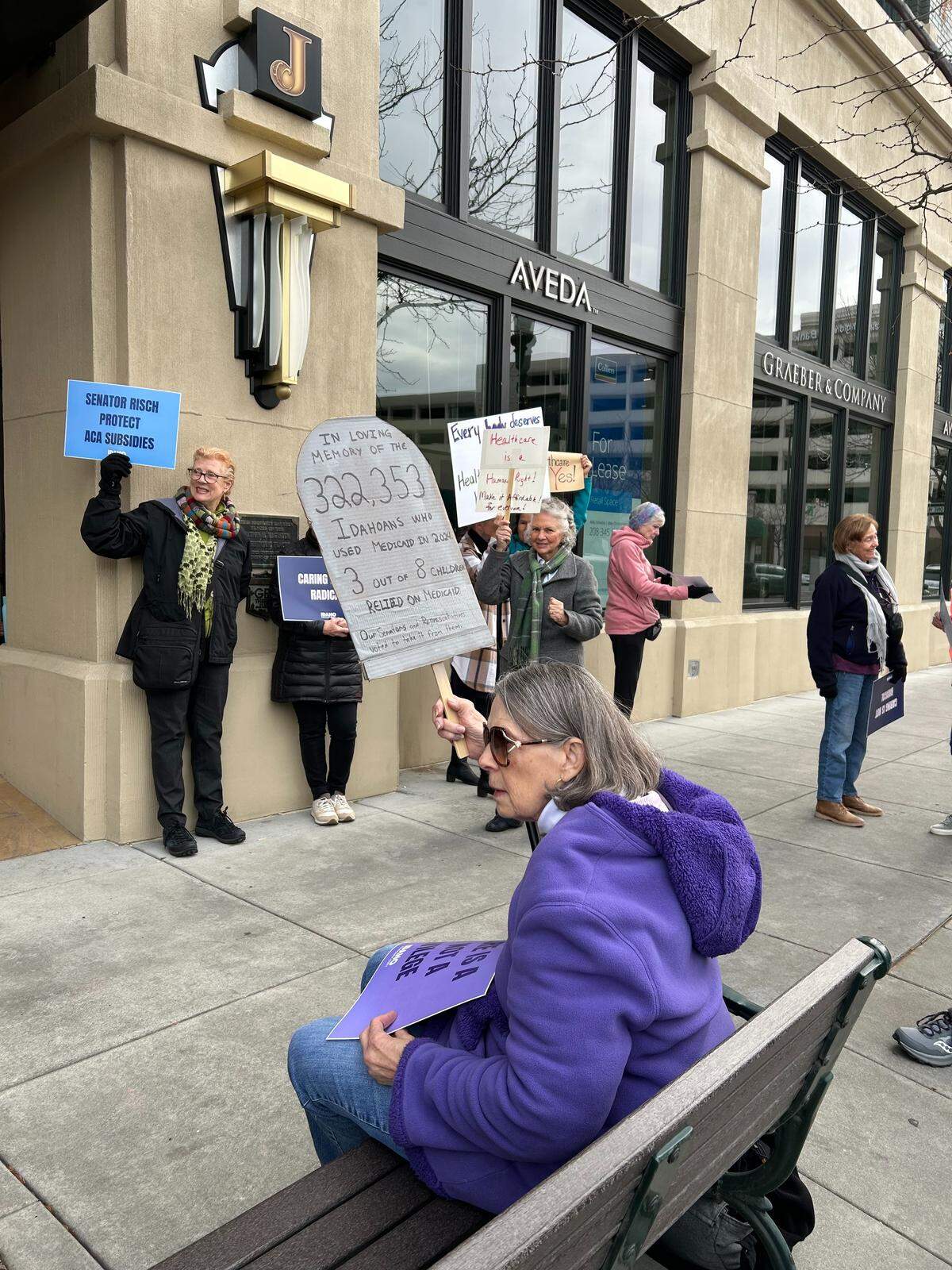 Boise resident Kris Hooker joins a protest outside U.S. Sen. Jim Risch’s office in Boise on Tuesday. Ada County Democrats, who organized the protest, warned Idaho would be “ground zero” for a health care crisis if federal lawmakers do not renew Affordable Care Act subsidies by the end of the year.