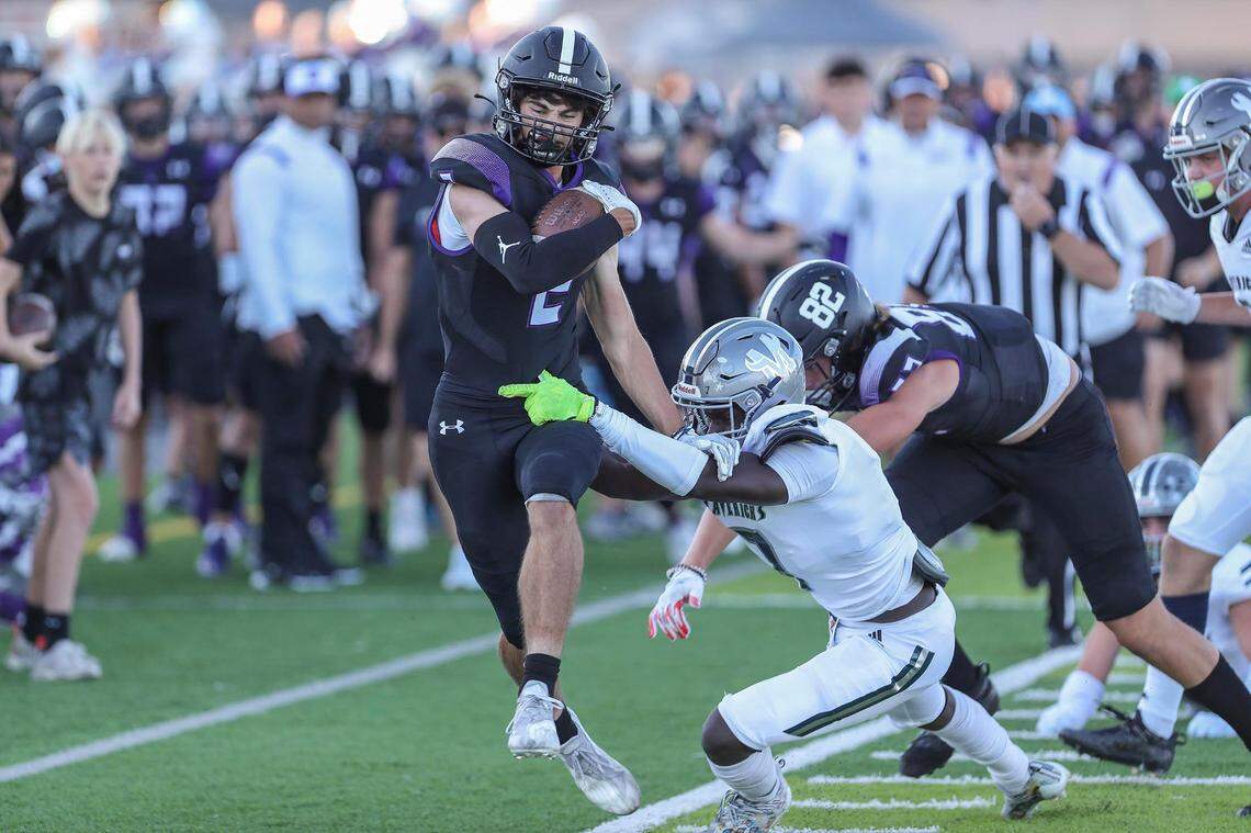Rocky Mountain wide receiver Hunter Steacker tries to slip a tackle from Mountain View’s Alameen Abimbola on Sept. 3.