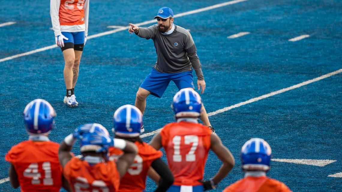 Boise State co-defensive coordinator Kane Ioane directs a drill during spring practice.