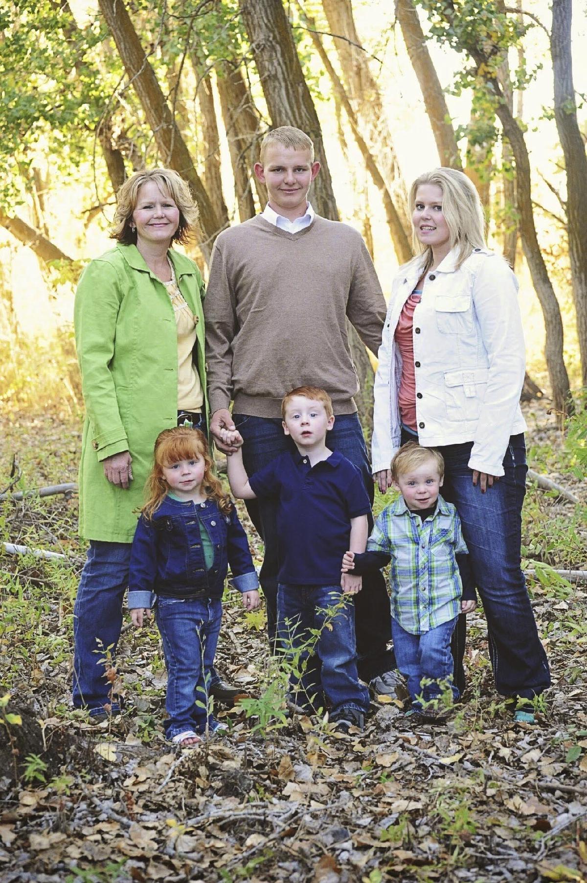 Tricia Ellinger stands with her two biological children, Greg and Allison, and three adopted children, Matthew, center, Cassie and Cash. (photo provided by the Ellinger family)