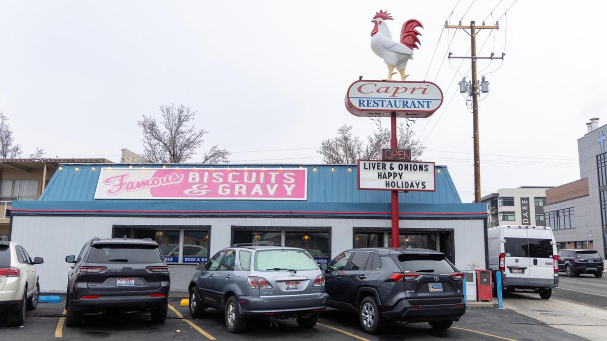 A large statue named Rudy the Rooster stands on top of the Capri Restaurant sign in west downtown Boise. The future of the rooster is up in the air after the property went up for sale in October.