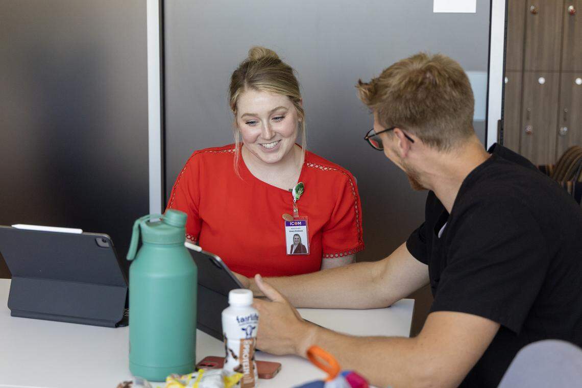 ICOM students Avery Erickson and Jonathan Shipp use a study room at the private college.