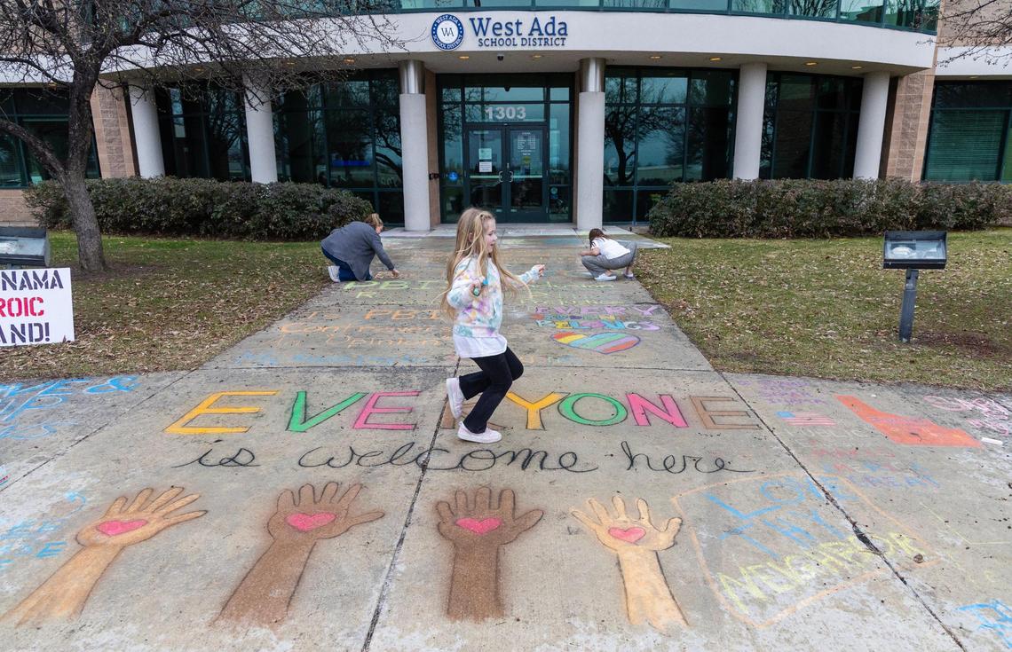 People gathered at the West Ada School District office in Meridian to chalk the words “Everyone is welcome here.”