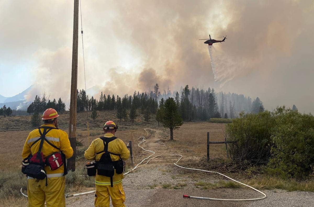 Firefighters from multiple agencies have traveled to the Stanley area to assist fighting the Wapiti wildfire.