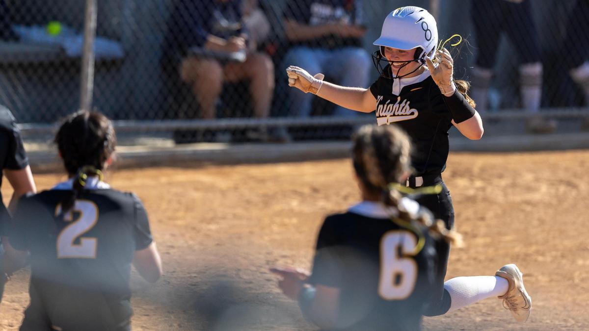 Bishop Kelly’s Olivia Watt crosses home plate during the 5A district championship game against Middleton last season.