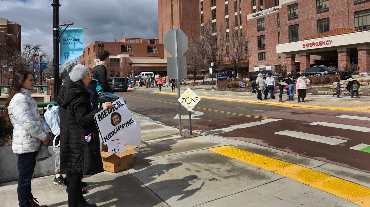 Protesters gather outside of St. Luke’s Boise Medical Center in downtown Boise Tuesday, March 15, 2022, holding signs and shouting at Boise police who responded as the medical facility went into a security lockdown. Far-right activist Ammon Bundy, who was arrested for trespassing over the weekend at the St. Luke’s Meridian hosptial, called for the protest today in Boise via social media video.