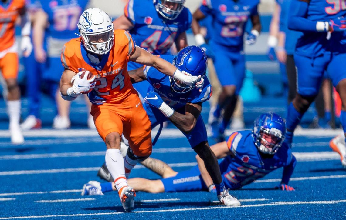 Boise State running back George Holani weaves through his teammates on defense during the 2021 Spring Game on April 10, 2021, at Albertsons Stadium in Boise.