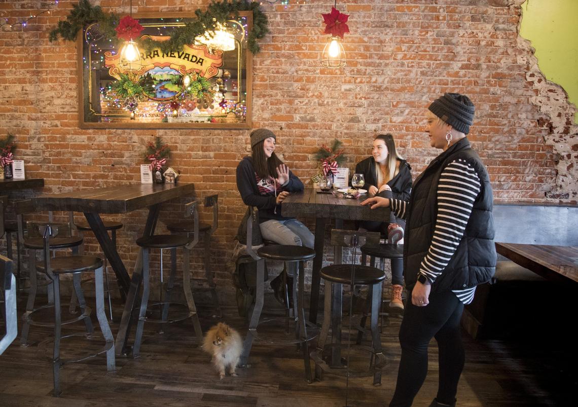 Owner Heather Driscoll, right, talks with Aidan Erickson, center, and Elizabeth Rigering, who come to PreFunk “all the time,” says Rigering. “Everyone’s just really cool. It’s our go-to place to hang out.” Erickson will work at Mesa, a taqueria and tequila bar across the street, when it opens in January.