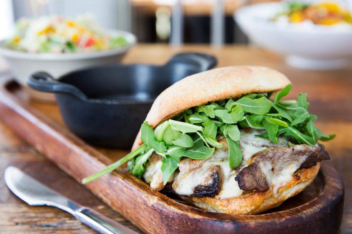 The steak dip sandwich ($21) is coulette steak, caramelized onions, provolone, mascarpone, fig mustard and arugula on a ciabatta bun with a side of au jus. It’s served with a side salad or french fries.