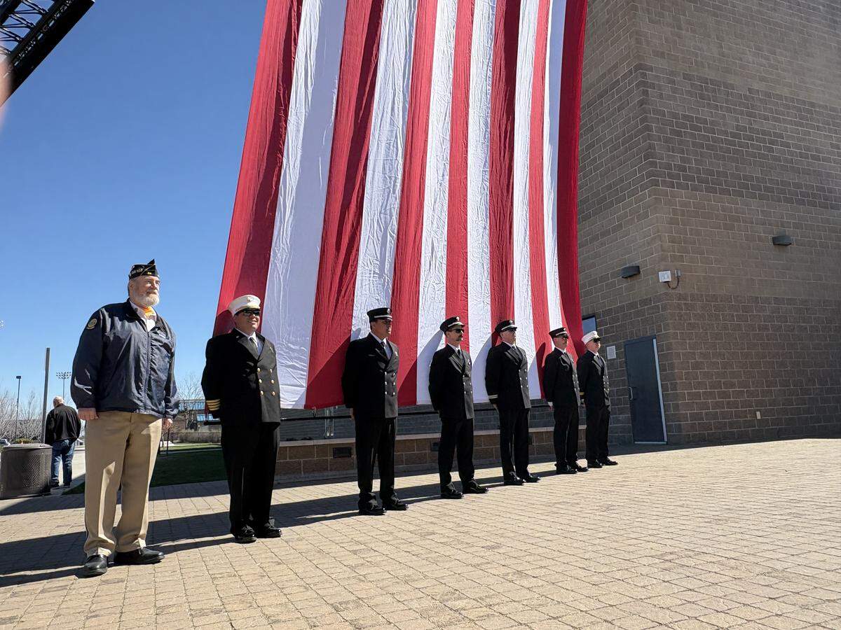 American Legion Post 30 Commander Fred Webb, left, and an honor guard from the Middleton Rural Fire Department during the honorary procession for Mayor Hutchinson. 