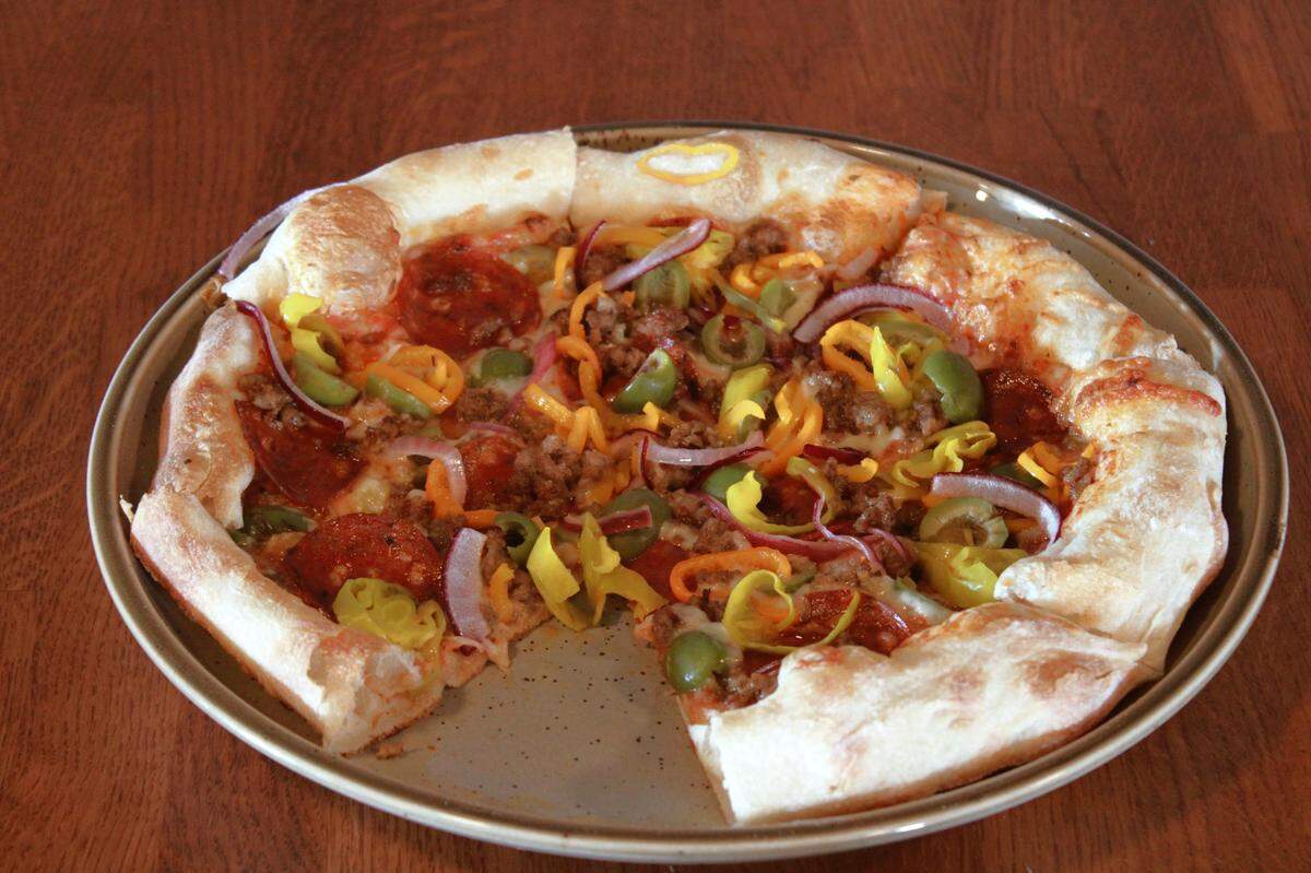 Pizza is on the menu at Black Moon now; the restaurant’s bakery concept is coming in a few months.