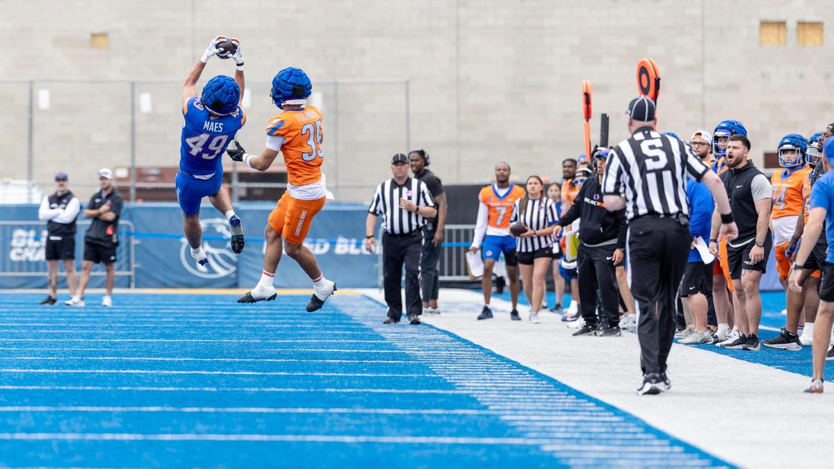 Boise State wide receiver AJ Maes makes a catch and Treyvon Tolmaire defends during the spring football game at Albertsons Stadium, Saturday, April 19, 2025.